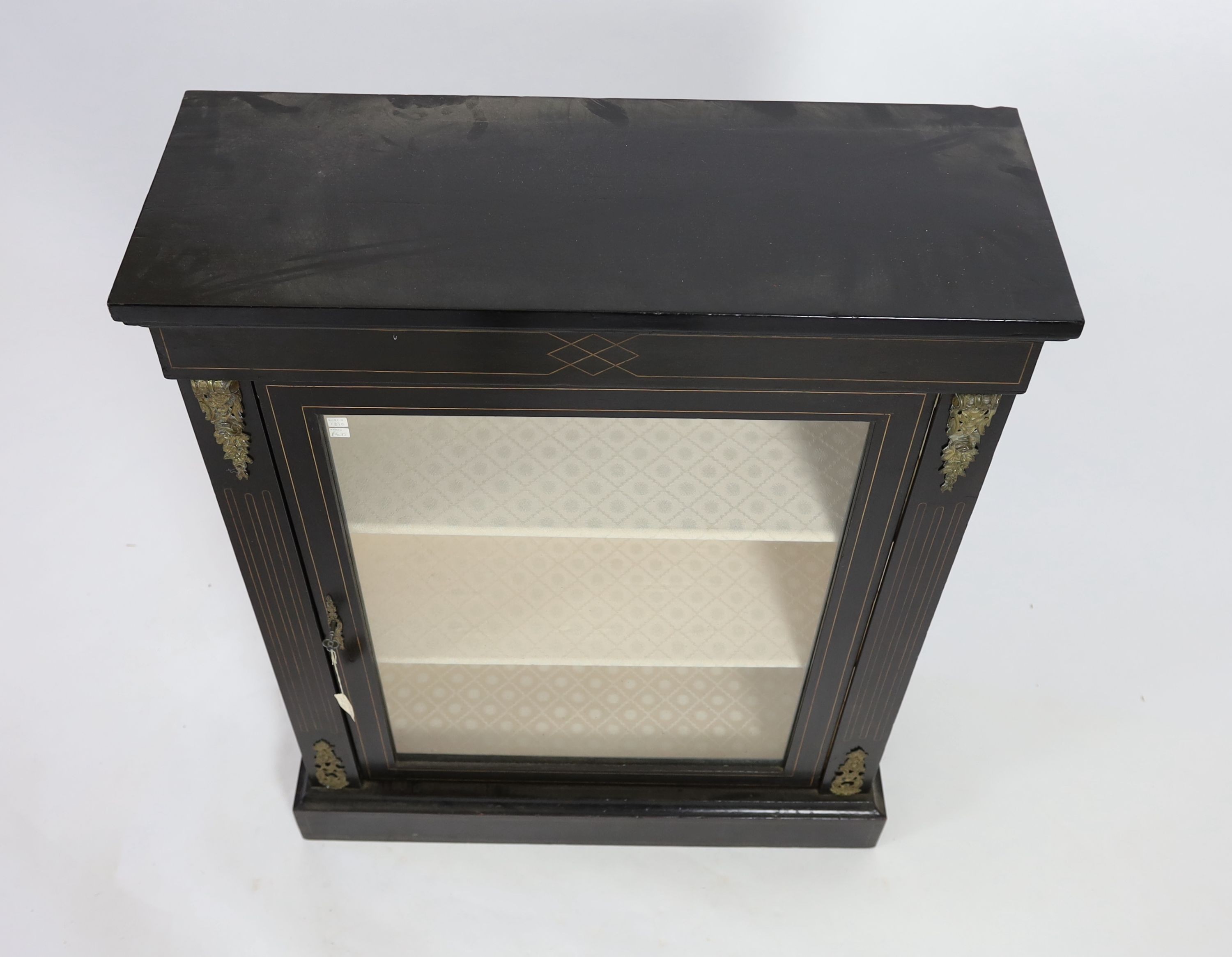 A Victorian gilt metal mounted ebonised pier cabinet, width 81cm depth 30cm height 104cm